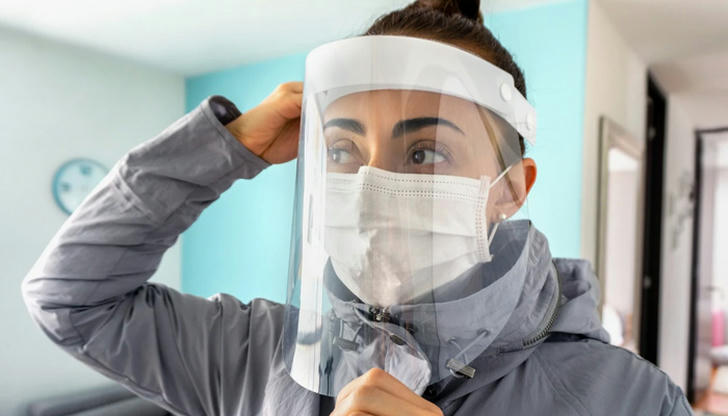 Which protective equipment helps shield healthcare workers from fluid splashes?