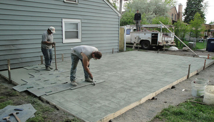 What is the typical cost range for installing a residential concrete patio?