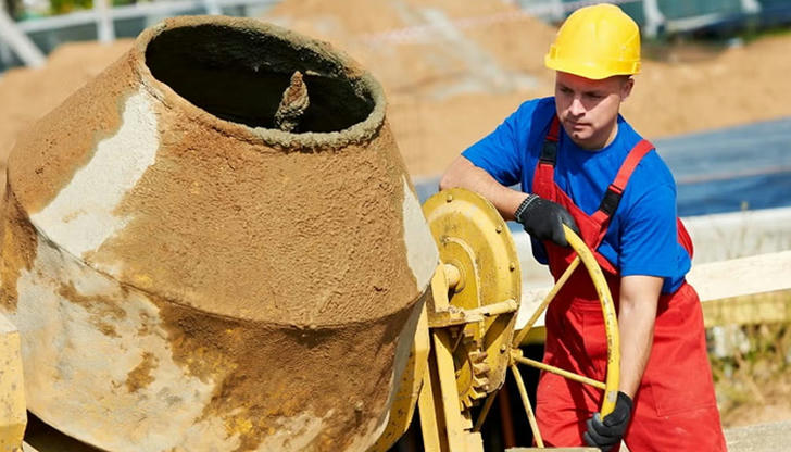 Which machine is commonly used to mix large amounts of concrete?