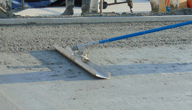 What is the purpose of using a concrete float?