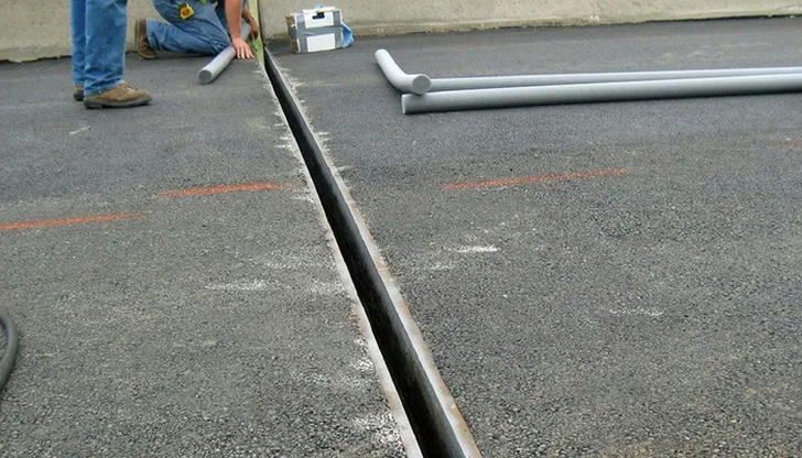 What is the purpose of expansion joints in concrete slabs?