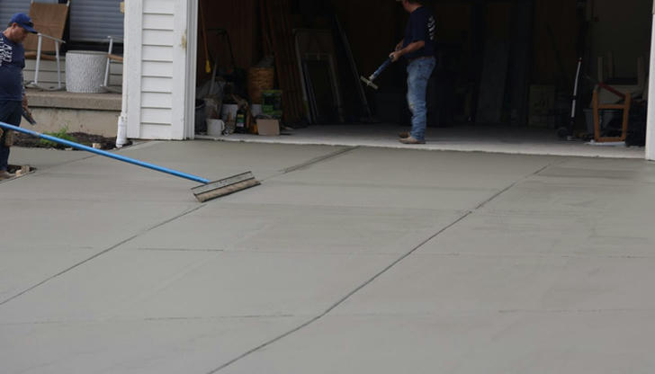 How long can a properly installed concrete driveway typically last?