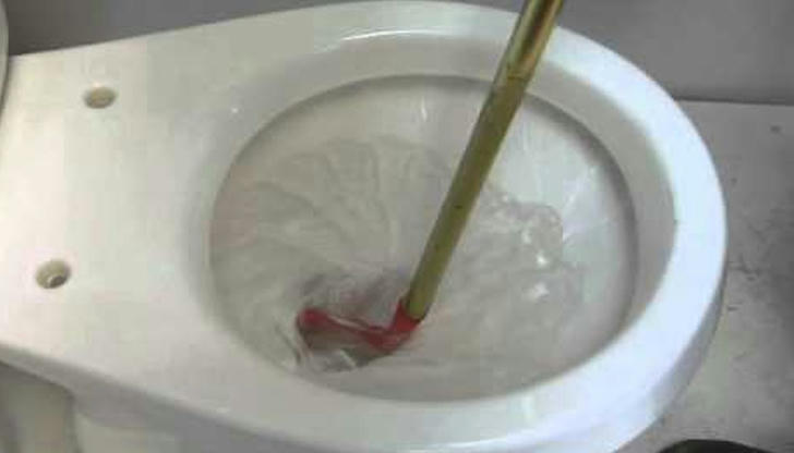 Which tool is designed to clean toilet traps?