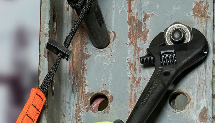 Which wrench is used to remove and replace flushometer nuts?