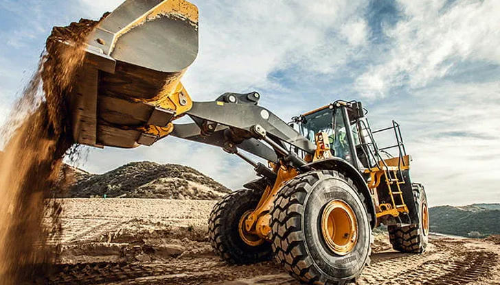 Which part allows a wheel loader to move smoothly on paved surfaces?