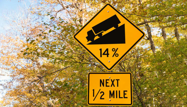 When descending a long hill, what’s the safest method?