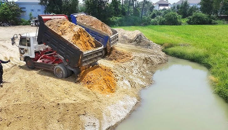 A bulldozer is designed to handle which task on a building project?