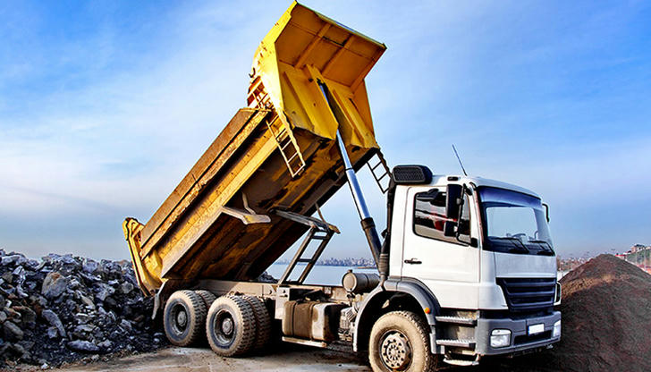 What is the main purpose of a dump truck?
