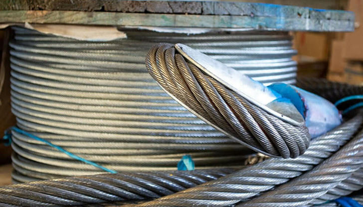 Before lifting any load, what should a crane operator inspect?