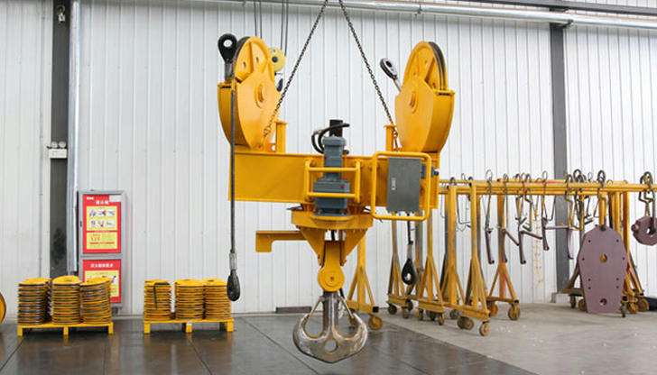 Which part of a crane should be checked regularly for signs of wear?