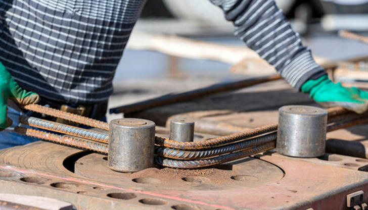 Which machine is used to bend steel bars for reinforced concrete work?