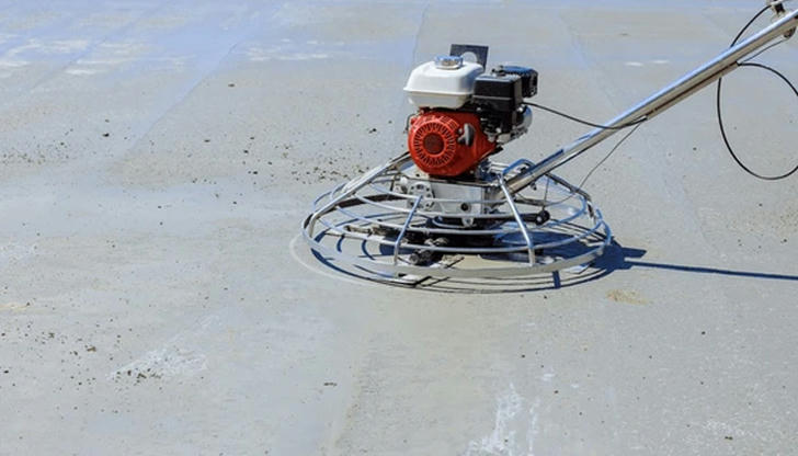 Which machine is designed to smooth and finish fresh concrete surfaces?