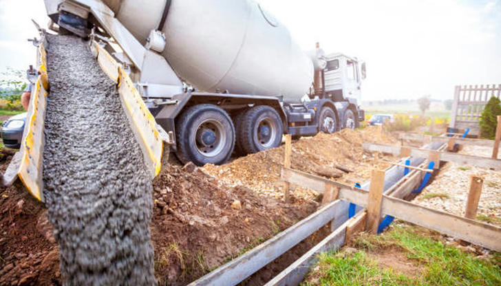 Which vehicle mixes and delivers concrete to job sites?