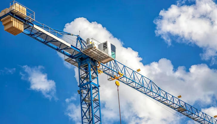 Which equipment lifts heavy materials to great heights on job sites?