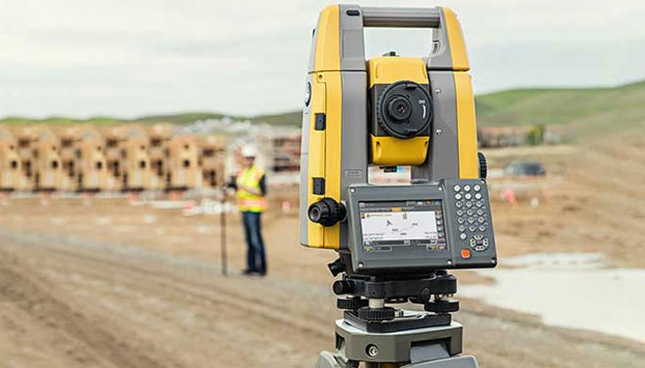 Which equipment helps measure angles and distances on job sites?