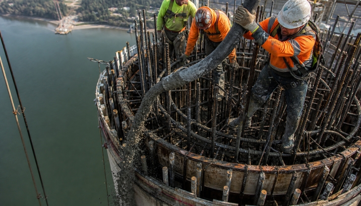 Which heavy vehicle features a long, remote-controlled articulated boom used to pump liquid concrete directly onto high floors or hard-to-reach casting spots?