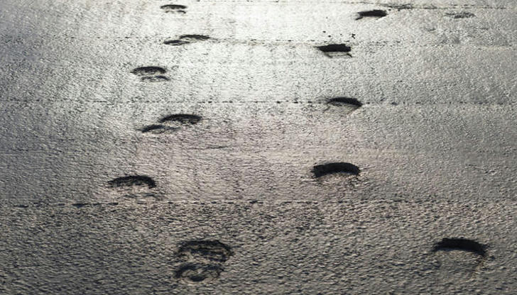 If concrete is dry but still curing, which action is usually safer?