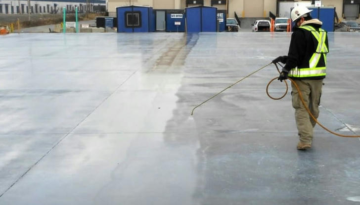 When new concrete is poured, which approach best supports proper curing?