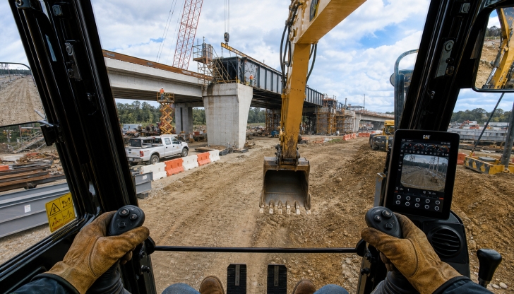 In standard ISO excavator controls, what does moving the LEFT joystick operate?
