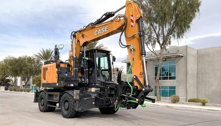 Which excavator rolls on wheels and works best on roads?