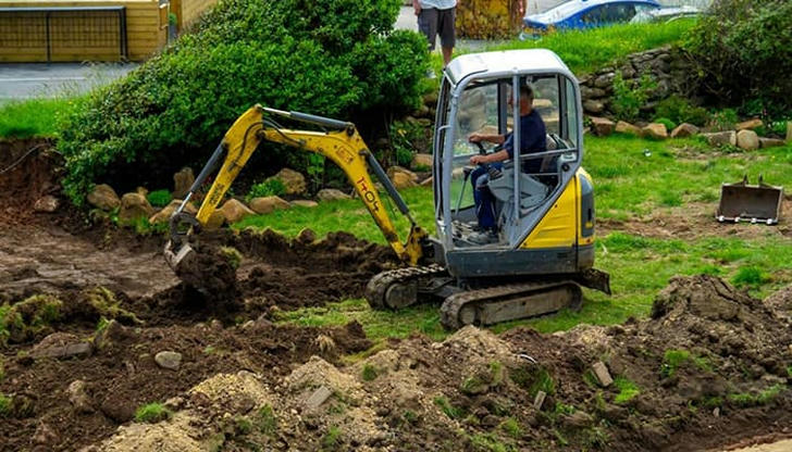 What is the main purpose of a mini excavator?