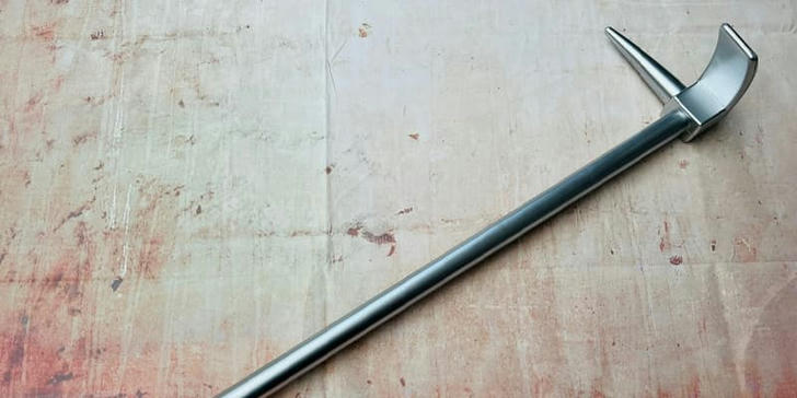 Which tool is commonly used by firefighters to break down doors during emergencies?