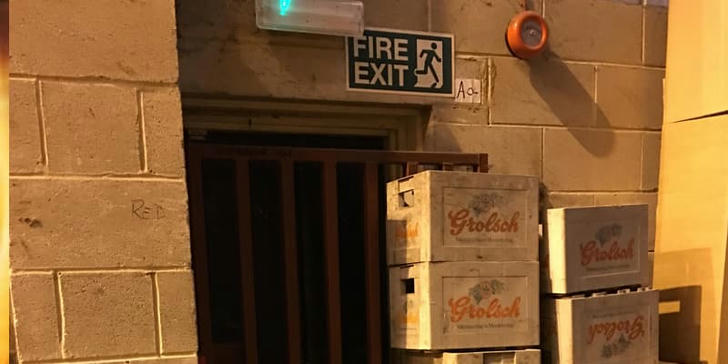 Which hazard arises from blocked fire exits?
