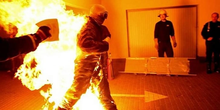 What should be done immediately if clothing catches fire?