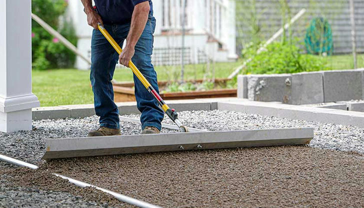Which phase comes after rough pushing but before final paving?