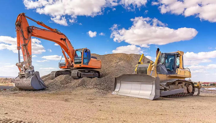 Which machines commonly work together on road construction?