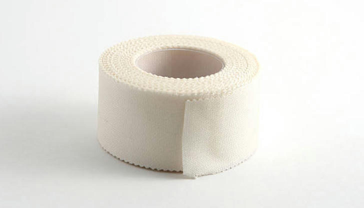 Which disposable item is used to secure dressings or gauze to the skin?