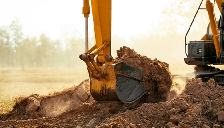 Which part scoops and carries material?