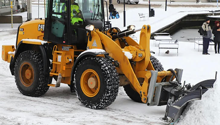 When turning with a load, what should the operator do?