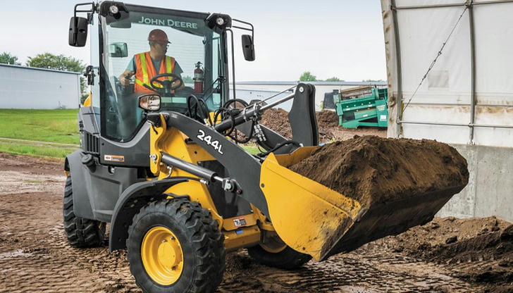 Which action prevents tipping when lifting a heavy load?