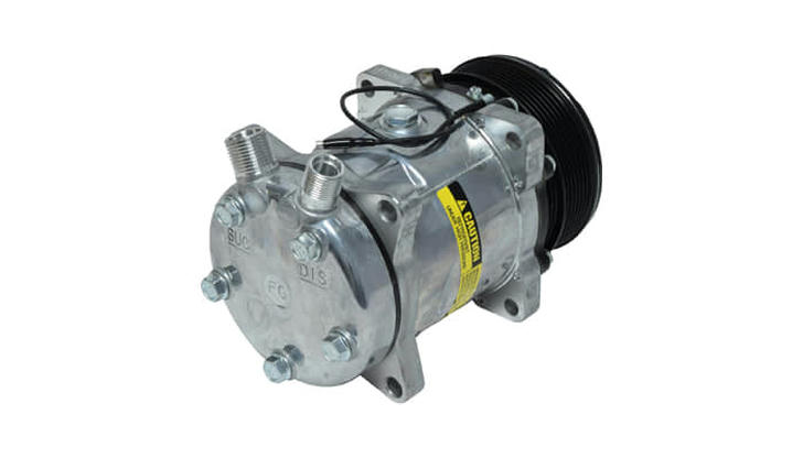 What’s the main job of the compressor in an air conditioning system?