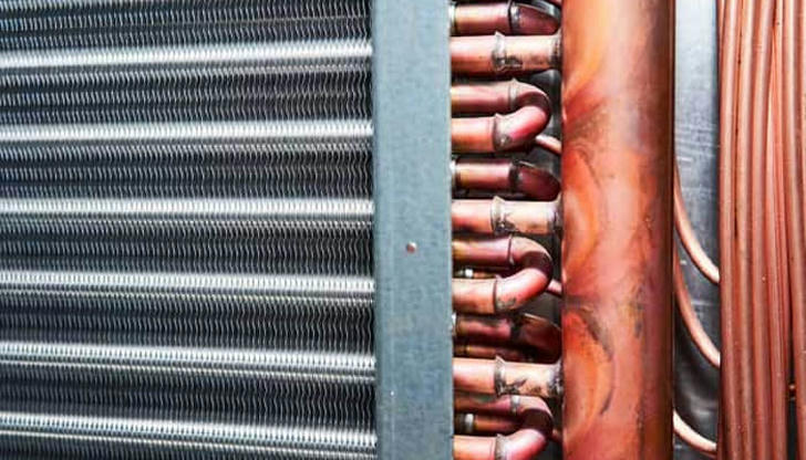 The condenser coil is usually located: