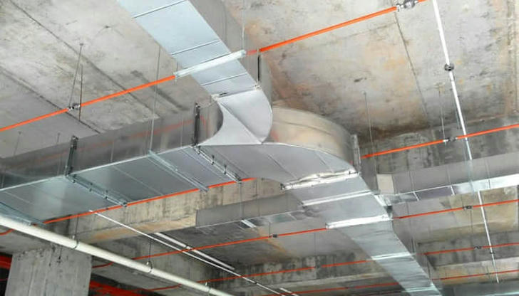 What do air ducts primarily do in an HVAC system?