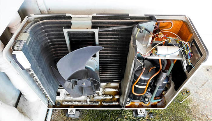What happens to refrigerant pressure as it leaves the compressor?