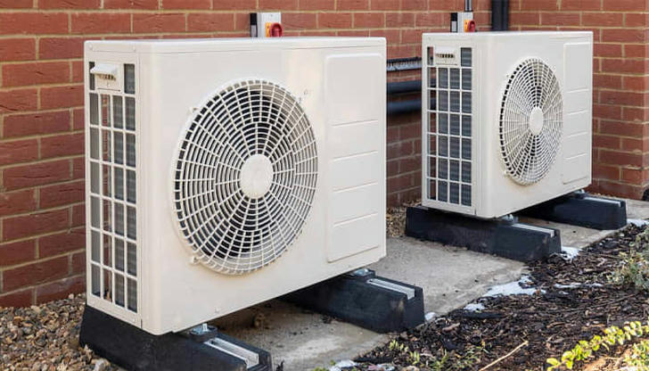 During heating mode (heat pump), what happens to the refrigerant’s direction?