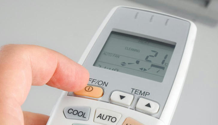 A burning smell comes from the vents when the system turns on. What should you do first?