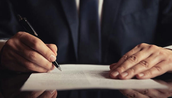 Which term describes a written order issued by a court commanding a person to perform or refrain from performing a specific act?