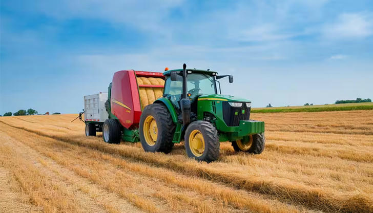 What does a baler produce from dried hay?