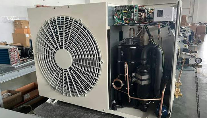 This component is often located outdoors and releases heat.