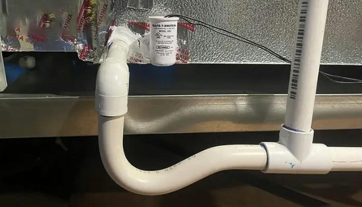 What is the purpose of a condensate drain line?