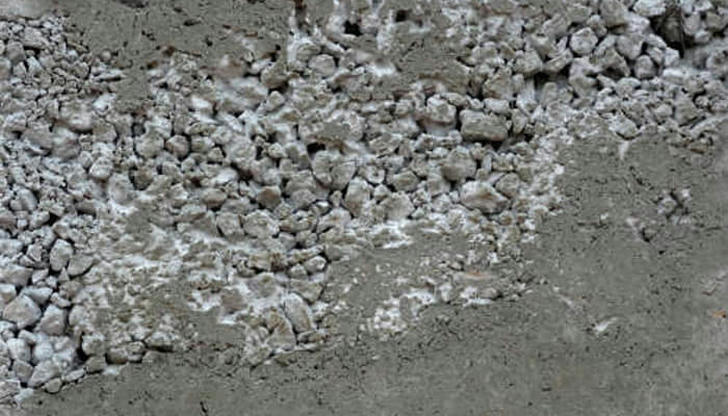 What could happen if you skip using a concrete vibrator when pouring deep footings?