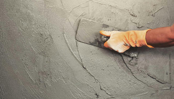 What is the consequence of using a trowel too early while the concrete is still too wet?