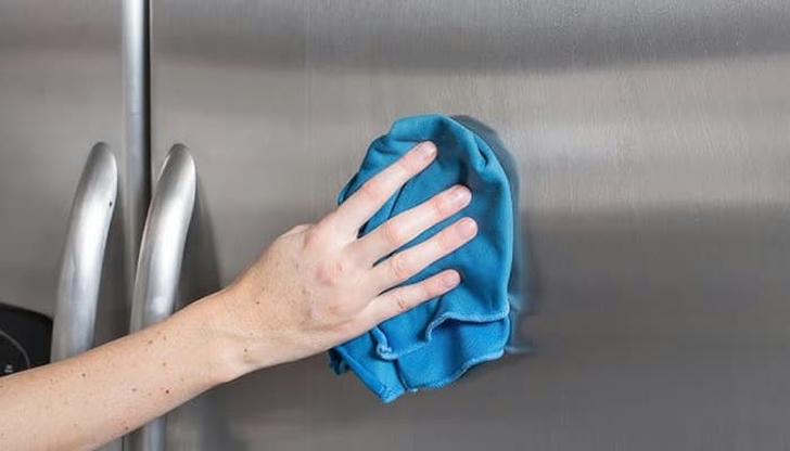 What tool is best for wiping stainless steel surfaces?