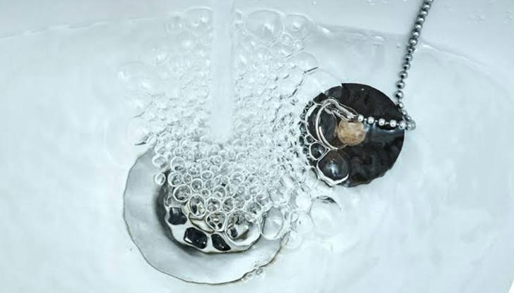Gurgling sound in drain usually indicates: