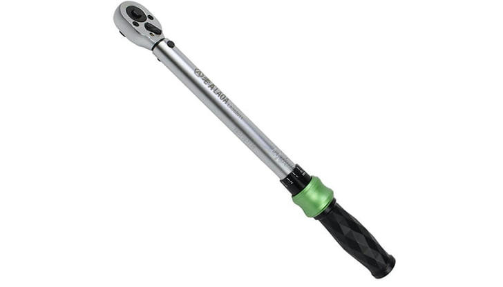 What is the primary function of a torque wrench?