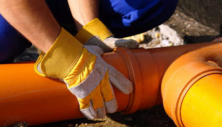 Why should you wear gloves when plumbing?